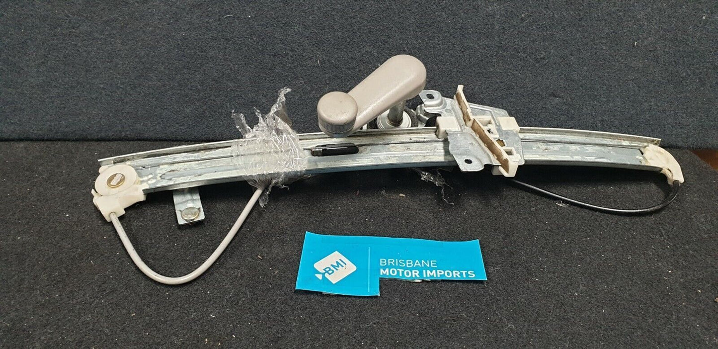 FORD LASER LEFTHAND FRONT WINDOW REG/MOTOR MANUAL TYPE - KN-KQ -1999-2002